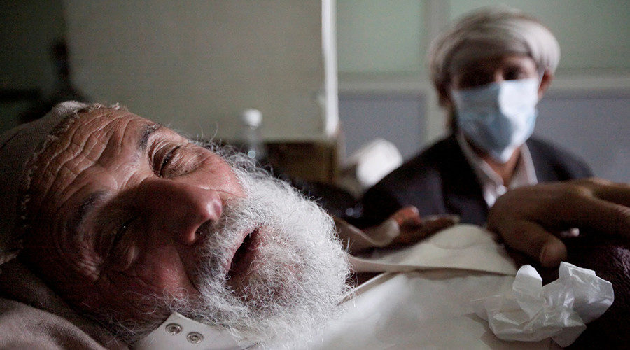 An old man infected with cholera lies on the bed at a hospital in Sanaa, Yemen
