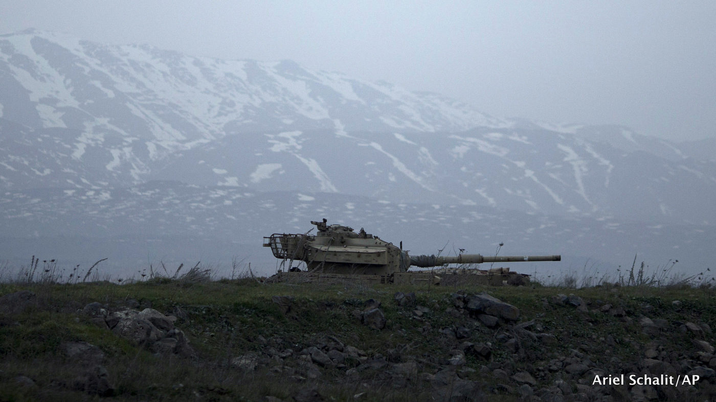 An old Israeli tank sits in a position in the Israeli-occupied Golan Heights