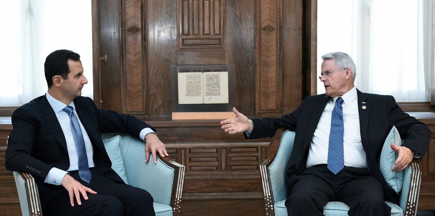 Senador Richad Black y Bashar Al Assad