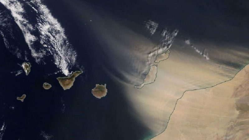 A satellite image shows the sandstorm blasting the Canary Islands from the east