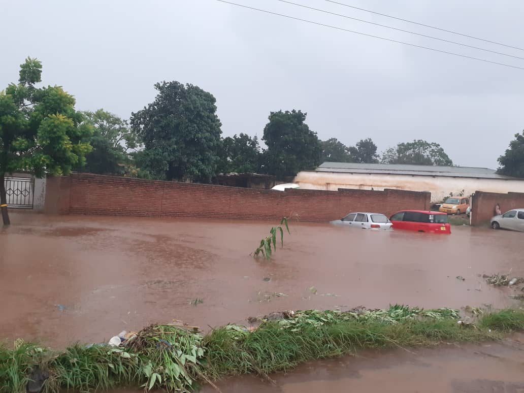 vehicles submerged in water at a garage in Biwi Township and Corporate Mall in Lilongwe