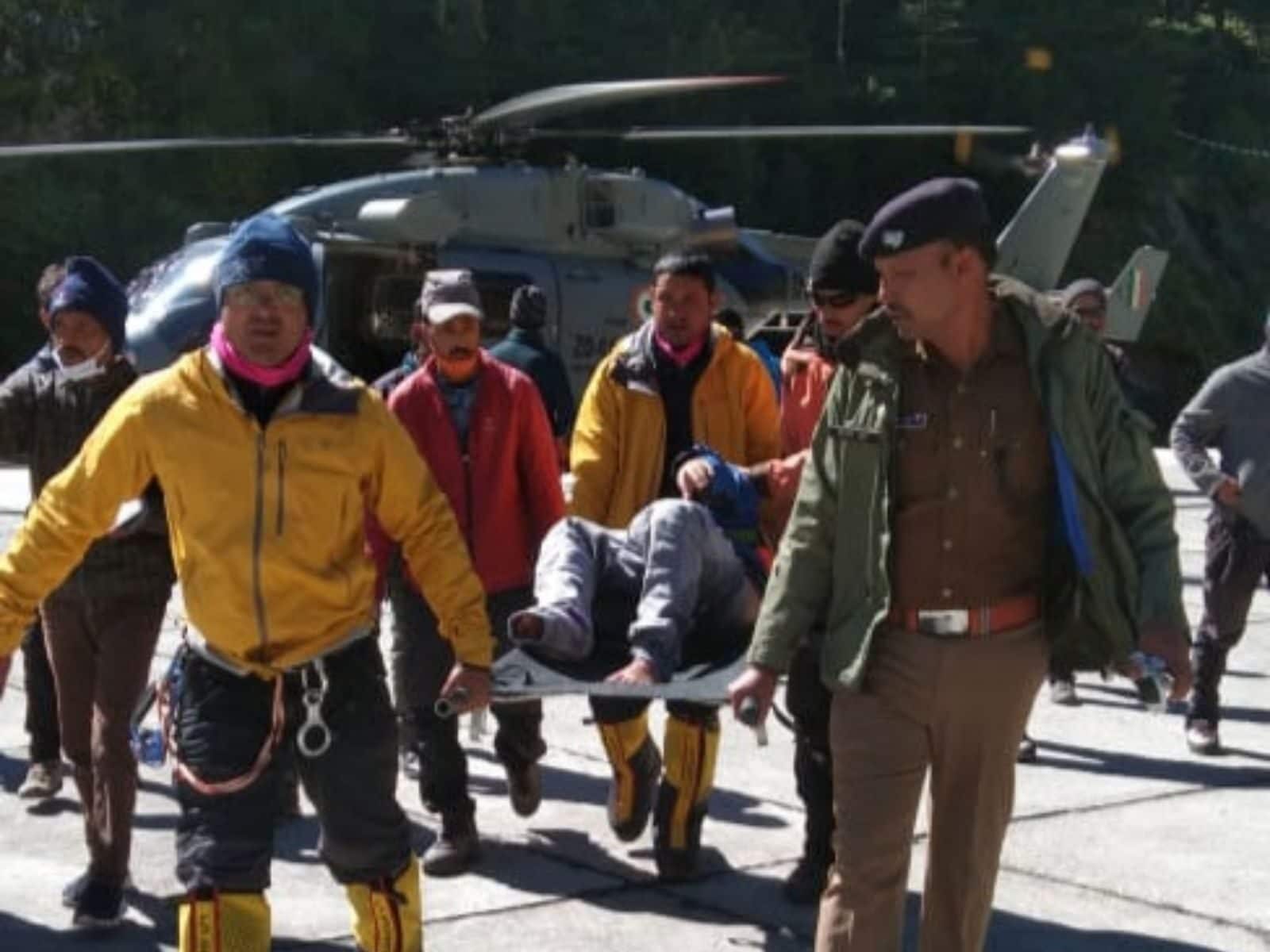 Rescue workers taking an injured trekker rescued from Lamkhaga Pass to hospital on Thursday