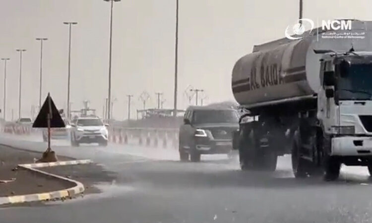 vehicles move at a slow pace during have rain in Abu Dhabi.