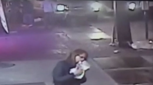 Woman eats pizza as accident unfolds