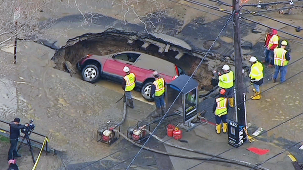 A huge sinkhole swallowed an SUV after a water main break flooded streets in Hoboken Tuesday morning.