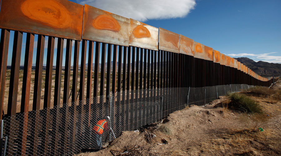 US worker inspects a section of the US-Mexico border wall