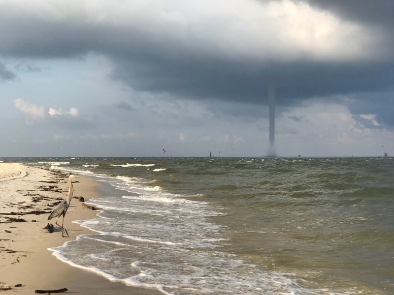 FOX10 News viewer Sam Sumlin provides these images of a waterspout seen from the beach at Fort Morgan.