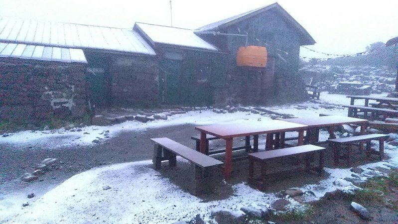 An area near the peak of Mount Kurodake in central Hokkaido is covered with the first snow of the season in the early morning of Aug. 17, the earliest snowfall recorded since 1974.