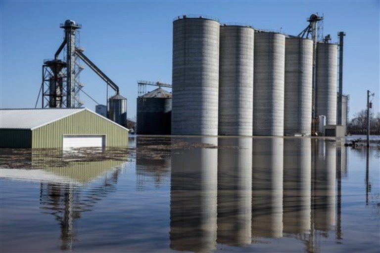 Bartlett Grain Company grain elevators are surrounded by floodwaters in Hamburg, Iowa