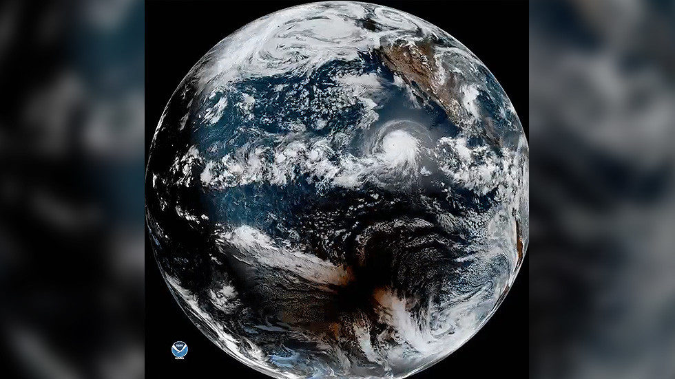Incredible satellite footage catches huge hurricane and solar eclipse at the same time