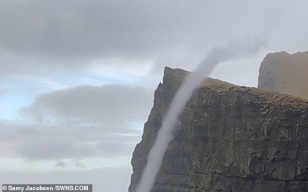 Samy Jacobsen, 41, was out walking along the cliffs off Suðuroy in the Faroe Islands when he spotted a whirlwind of water rising from the waves