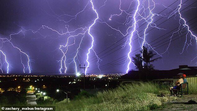 More than 8,000 properties across SA remain without power after storms lashed the state, with 300,000 lightning strikes reported (pictured, the storms on Tuesday over Adelaide)