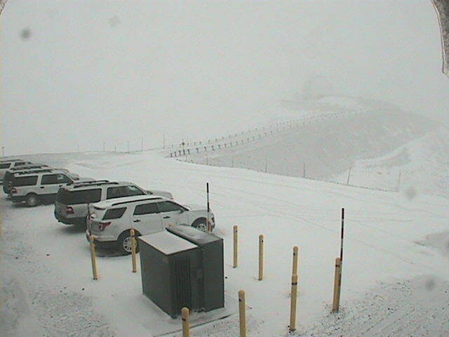 This webcam photo by W.M. Keck Observatory shows a dusting of snow in the observatory parking lot on Maunakea.