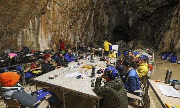 Members of the team meet to discuss their experiences.