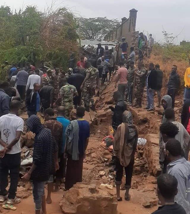 Nine people were killed yesterday when a 50 meter concrete wall collapsed on residential houses following four hours nonstop heavy rain in Dire Dawa city.
