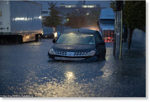 Cars were left stuck in the flood water in Greenpoint, Brooklyn on Tuesday as heavy rain hit the city