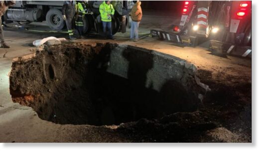 Dump truck falls into sinkhole in Birmingport