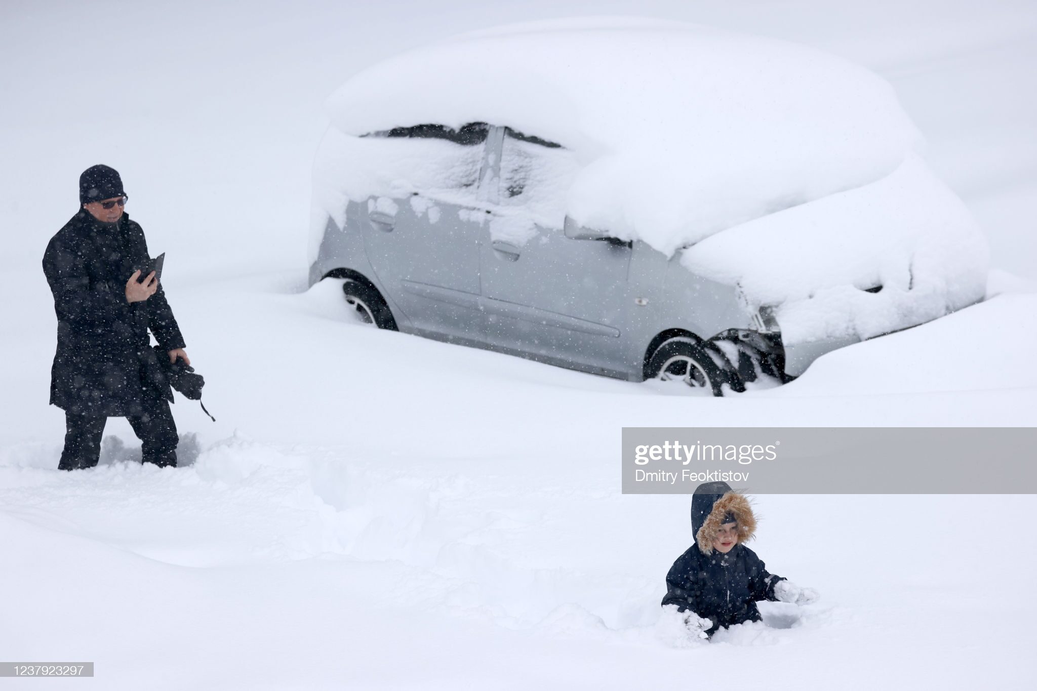 A child plays in deep snow in the city of Krasnodar, southwest Russia during a snowstorm.