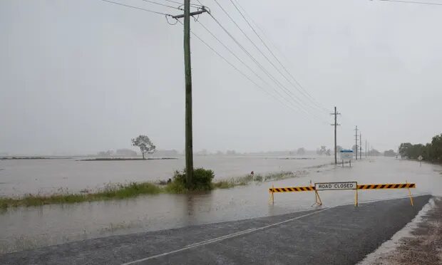 Flooding near Lowood in Queensland on Friday. Farmers and communities are counting the cost and beginning the clean-up as the flood waters subside across the state.