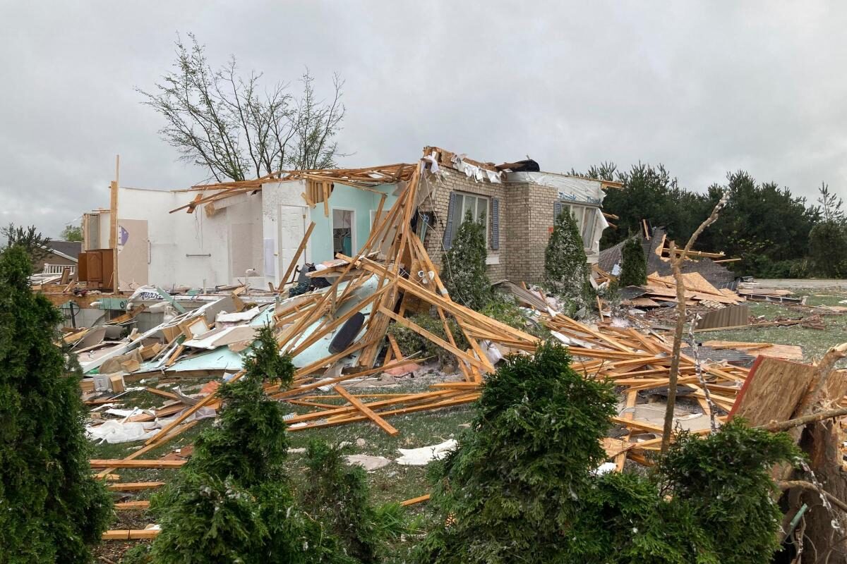 Damage is seen at a home after a tornado