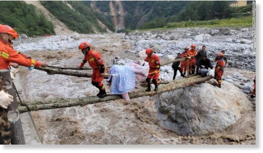Rescuers transfer injured people in Luding county, Ganzi prefecture, Sichuan Province