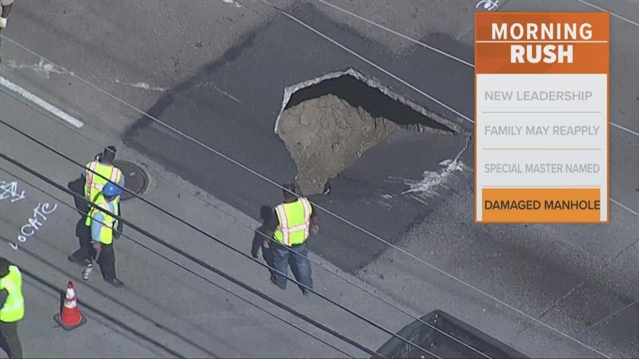 Crews blocked off the road to repair the several-feet deep hole.