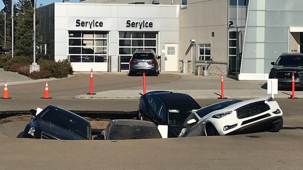 A number of vehicles were stuck at an Infiniti dealership in Edmonton on Tuesday, Sept. 20, 2022.
