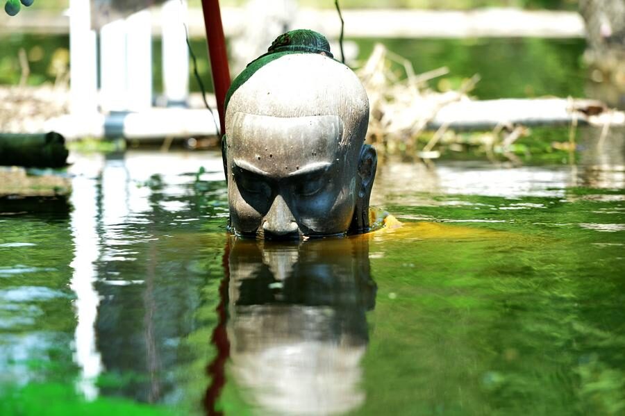 Photo taken on Oct. 18, 2022 shows a sculpture in a flooded area in Ayutthaya, Thailand.
