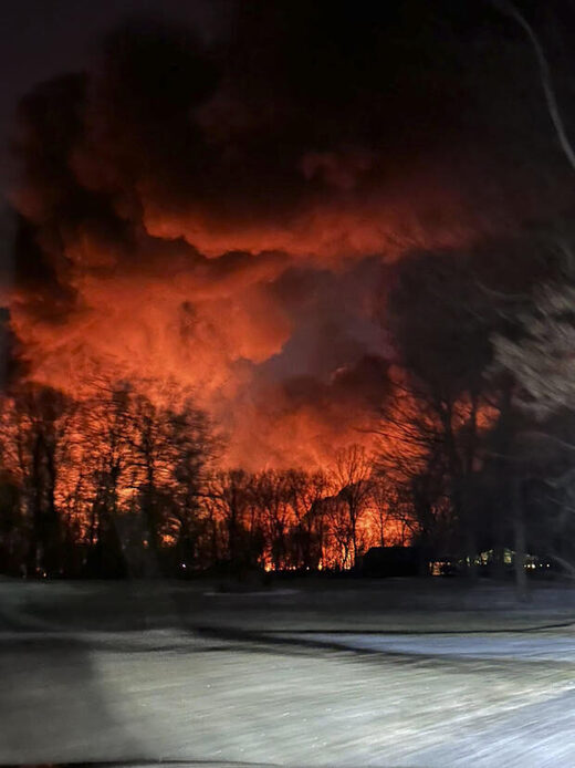 Train fire is seen from her farm in East Palestine, Ohio, Friday, Feb. 3, 2023.