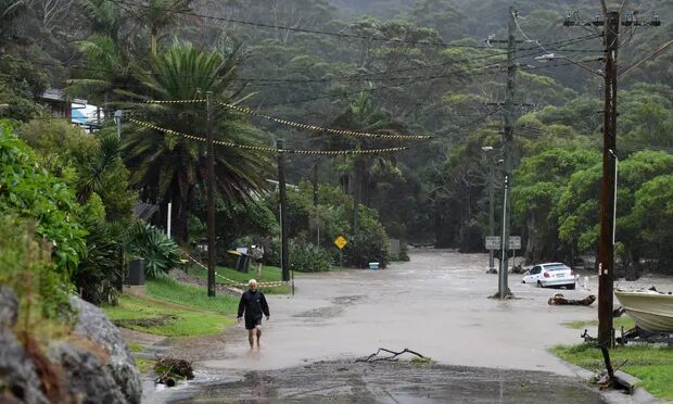 Flash flooding in Stanwell Park on Thursday after slow-moving storms hit the area between Wollongong and Sydney.