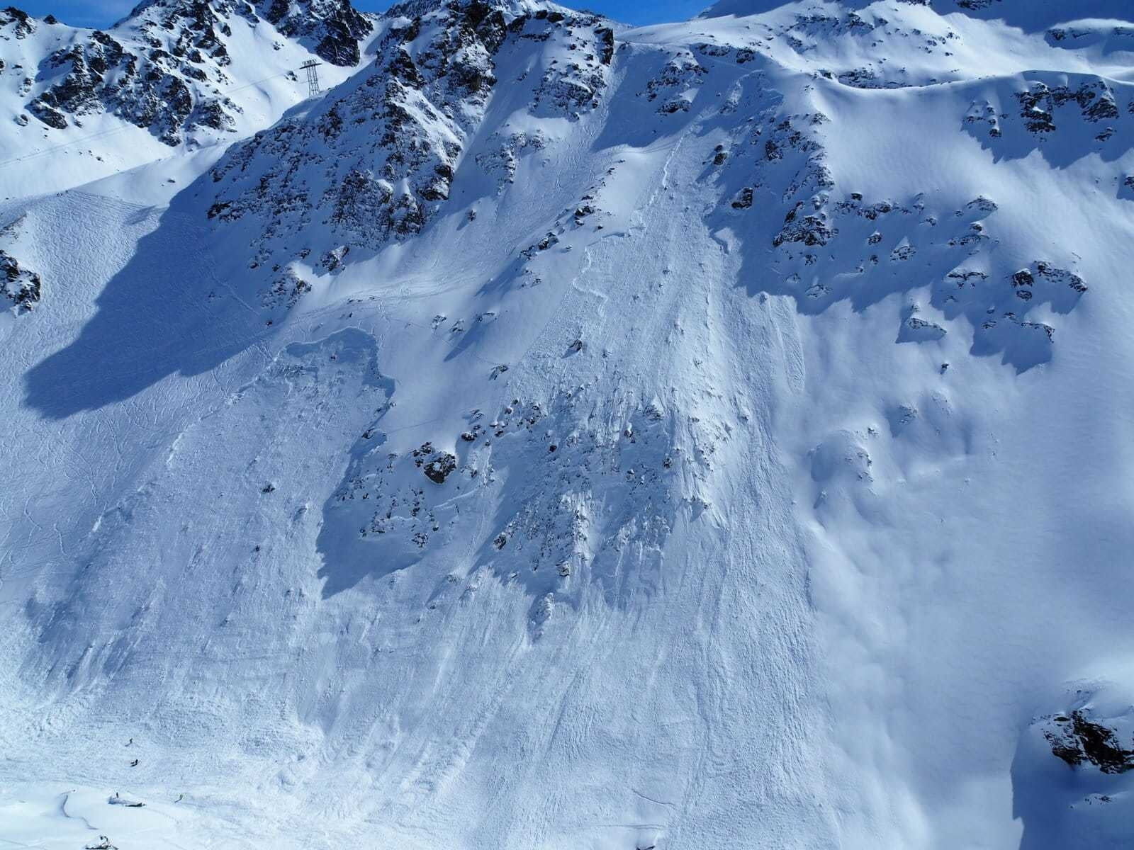 The enormous size of Wednesday’s fatal avalanche can be seen in comparison to Monday’s picture.