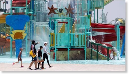 Visitors cool off at an amusement park in Hoi An, Vietnam.