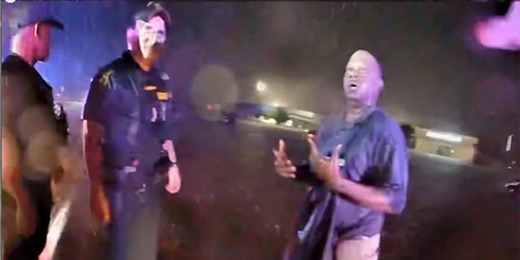 Escambia County sheriff's deputies assist a man rescued from floodwaters on Friday, June 16, 2023. The citizen and a deputy were both sucked into a drain pipe during a rescue attempt.