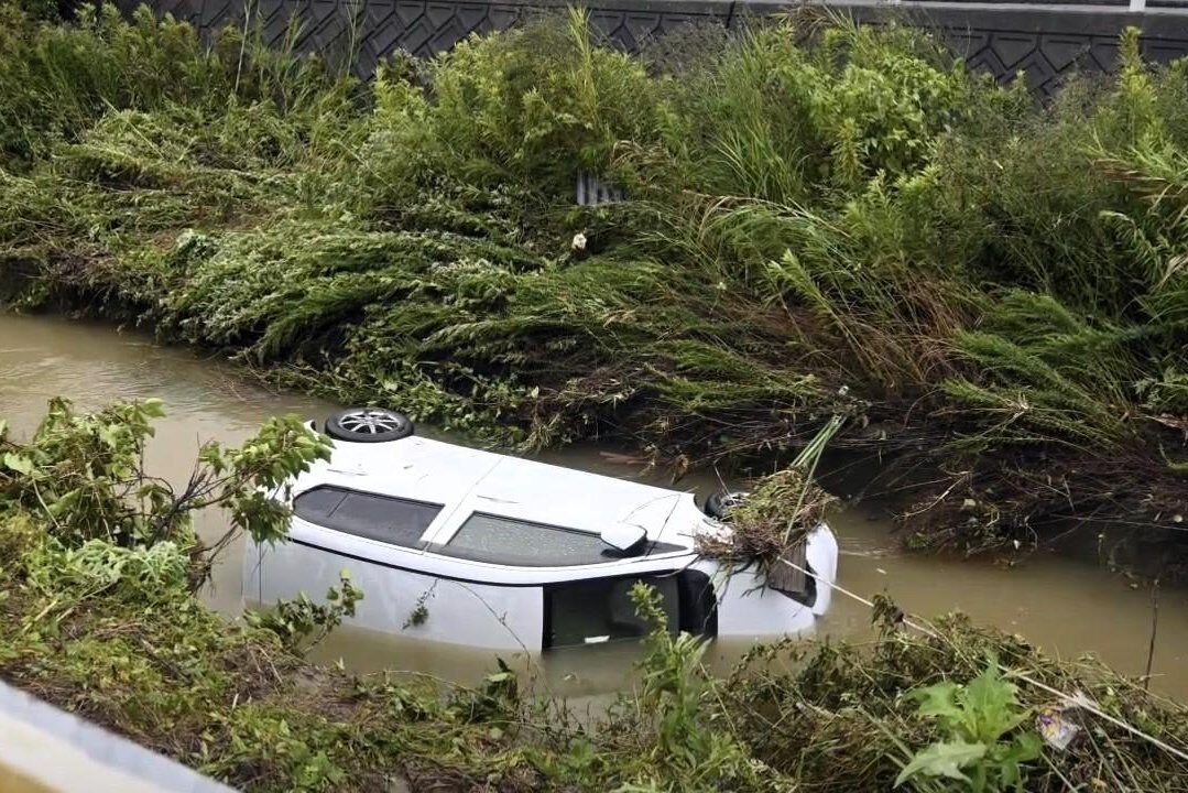 A car that was washed away in Yamaguchi Prefeture on Saturday