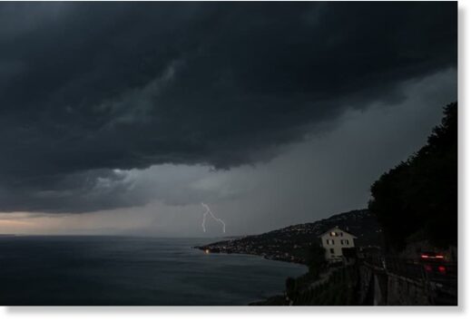 Lightning is seen above Lake Geneva from