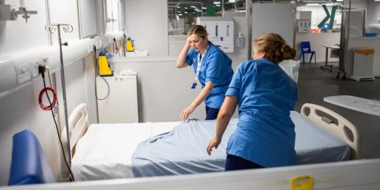 nurses prepare bed