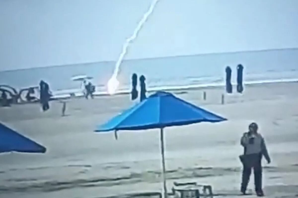 CCTV security video footage of the moment shows bikini-clad Froilanis suddenly hit by lightning