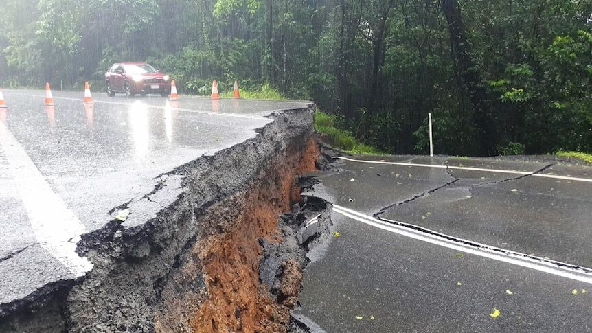 This photo from Transport and Main Roads Queensland shows severe damage to the Palmerston Highway after flooding caused by ex-Tropical Cyclone Jasper.