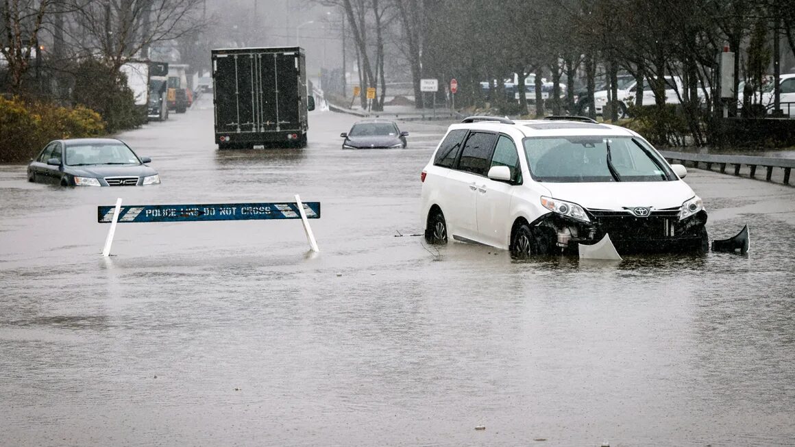 Cars are submerged in flood water in Elmsford, New York, after a powerful storm on Monday.