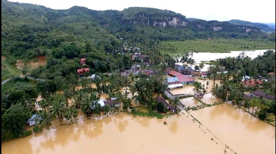 Photo shows houses submerged by floods due heavy rain at Lima Puluh Kota district in West Sumatra, Indonesia, Dec. 18, 2023.