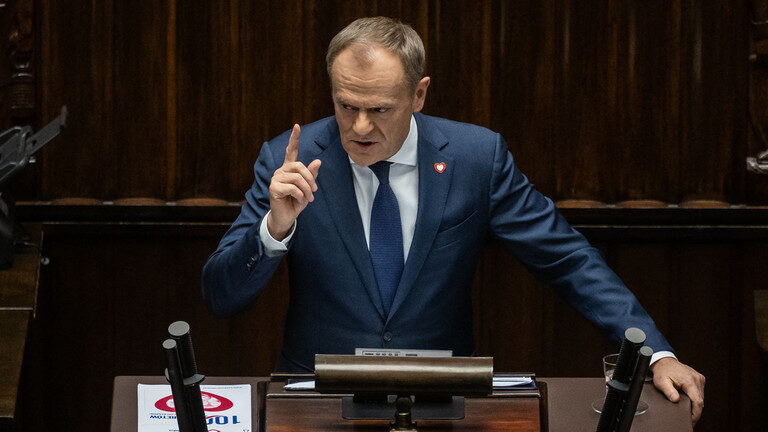 Polish Prime Minister Donald Tusk speaking at the parliament in Warsaw