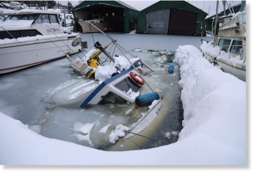 A sunken boat in Aurora Harbor on Wednesday, Jan. 24, 2024
