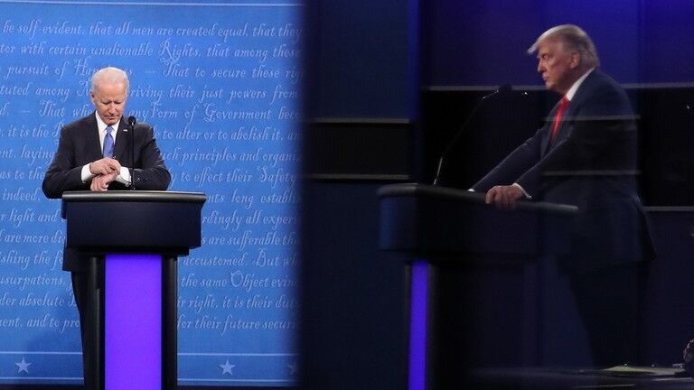 FILE PHOTO: Joe Biden and Donald Trump during a presidential debate in October 2020.