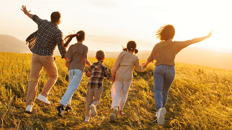 family running through field