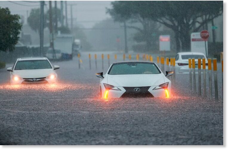 Stalled vehicles sit in a flooded street in Aventura, FL, June 12, 2024.