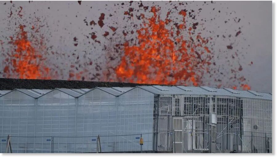 Clic para aumentar Flames and molten lava can be seen from a greenhouse on the outskirts of the nearby fishing town