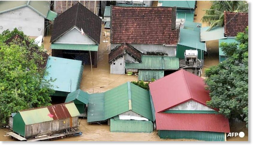 This aerial photo shows a flooded village in Vietnam's north-central Nghe An province on Jul 23, 2025, following heavy rains brought by tropical storm Wipha.