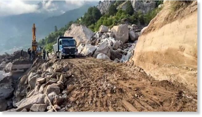 Debris being cleared from the blocked NH5 following a cloudburst, near Skibba village in Kinnaur district, Friday