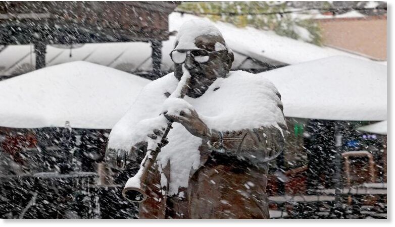 A statue of Pete Fountain is covered in snow inside New Orleans Musical Legends Park on Bourbon Street on January 21, 2025, in New Orleans, Louisiana.