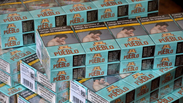 Packs of Spanish cigarettes seen stacked on a table